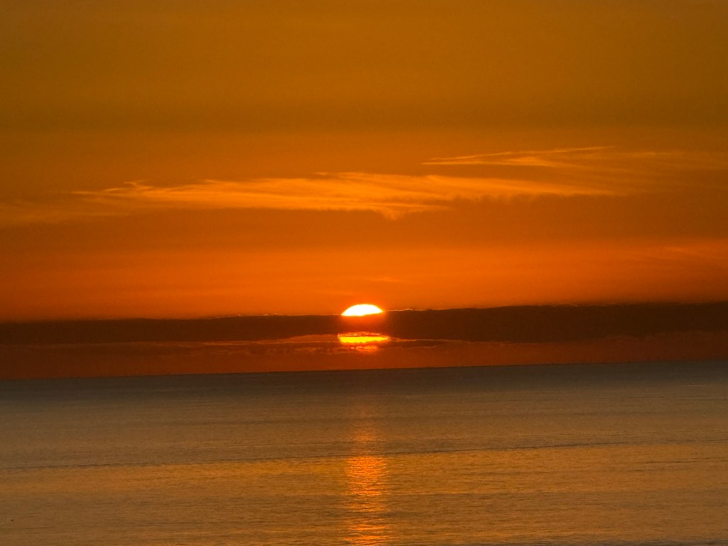 A sunset over a body of water.